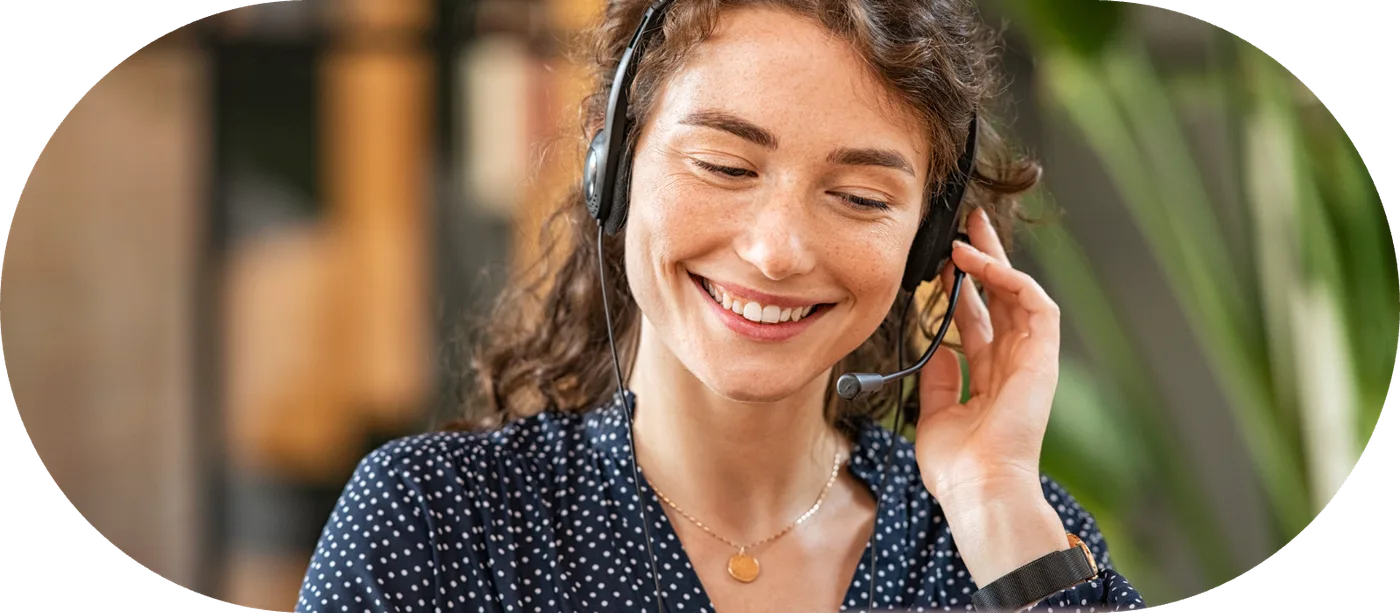 An agent wearing a headset answering a business call