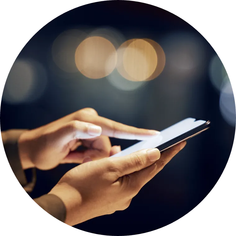 Reading a message on a phone in the evening